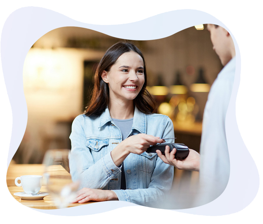 girl paying using POS machine