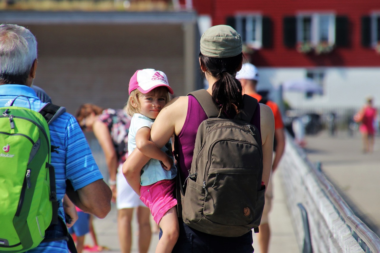 mum with child going at childcare center